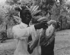 Baba Maina accepting the Peace Wreath